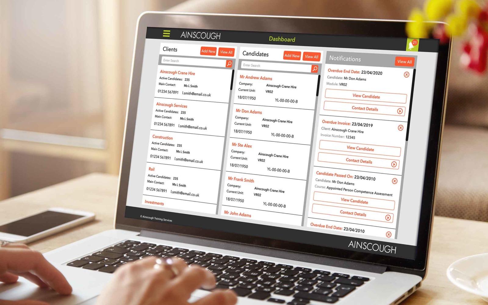 A computer showing Ainscough Training Services' training CRM and workflow management software