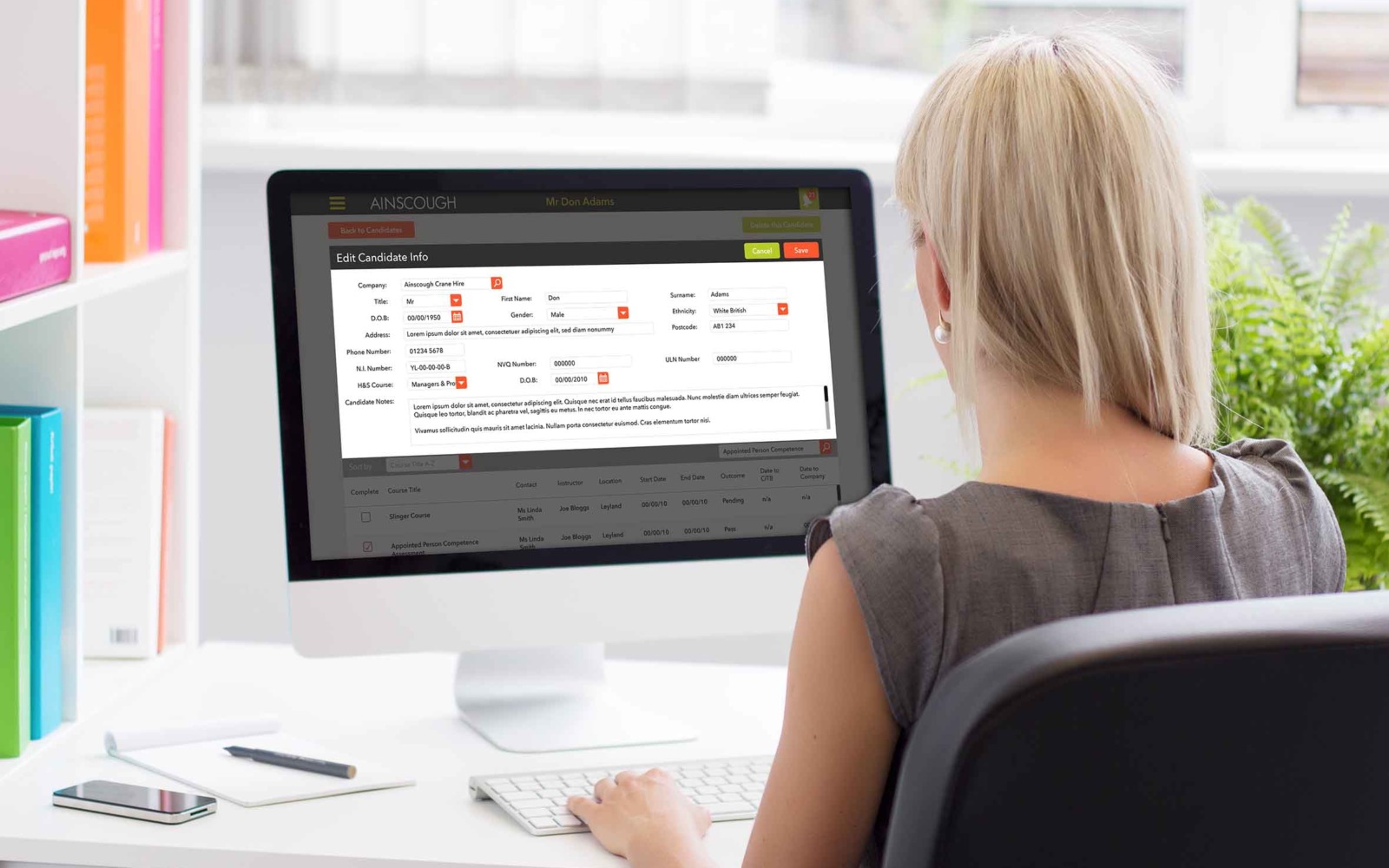 A young woman using Ainscough Training Services' training CRM and workflow management software