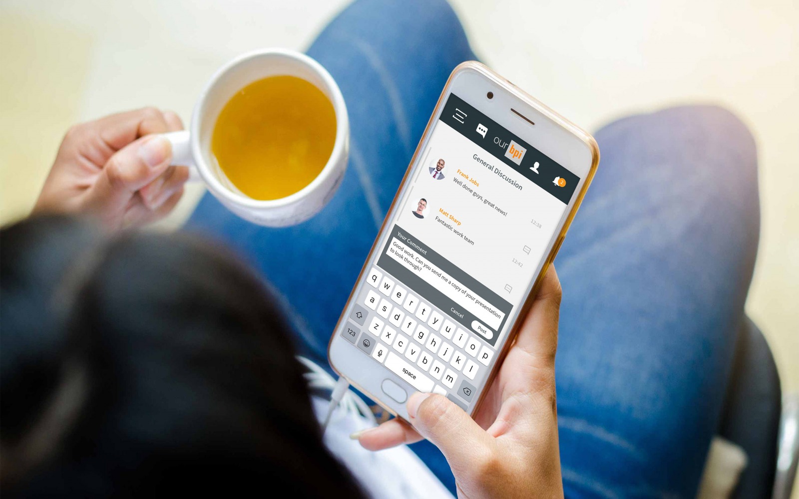 A woman using RPC bpi's intranet on a mobile phone while having a drink