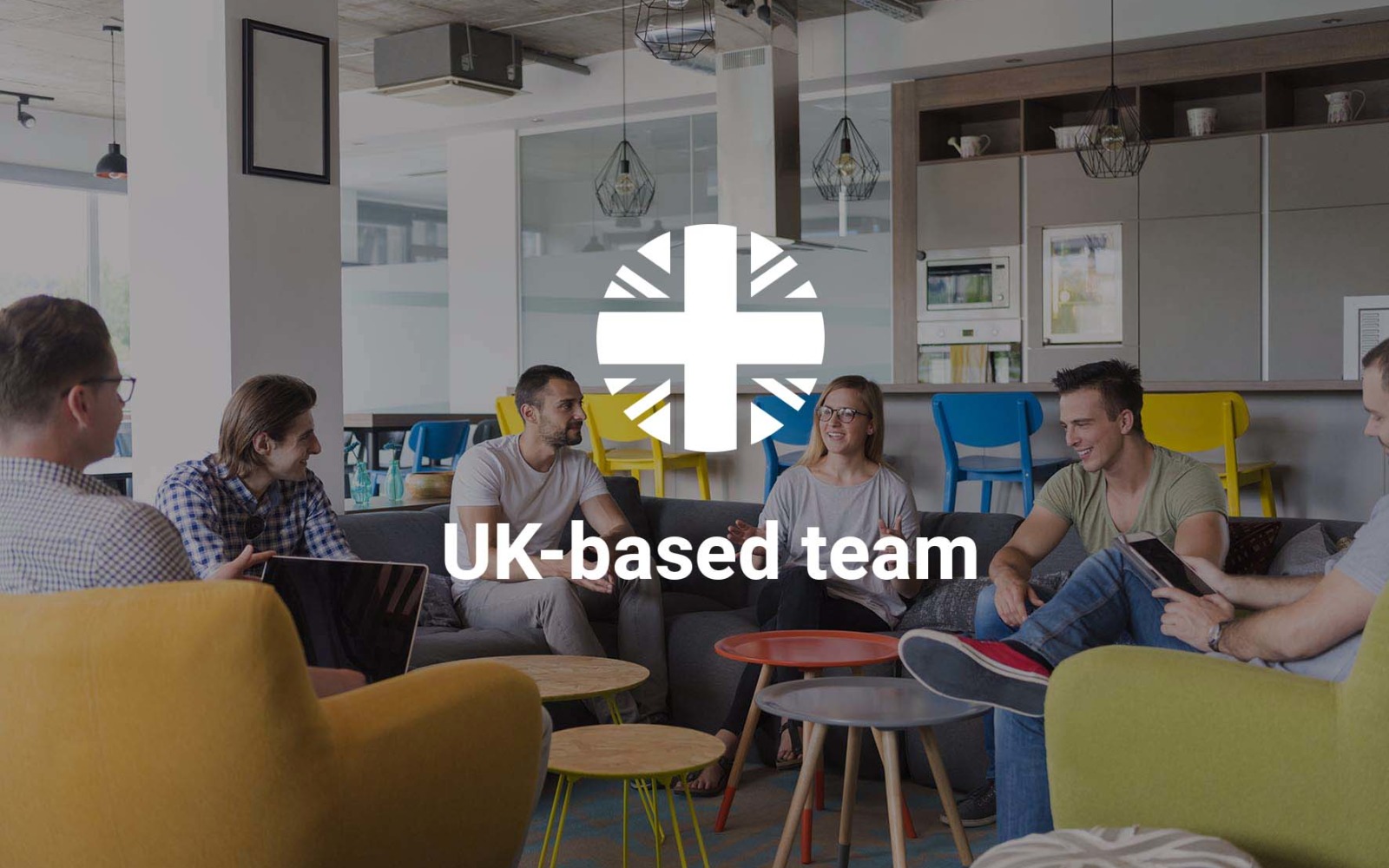 Group of people in modern office having team meeting and brainstorming while working on laptop and drinking coffee - represents Blue Wren's UK-based team
